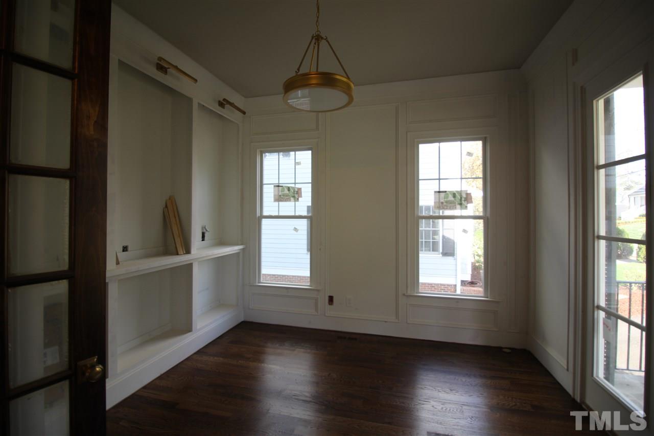 2705 1/2 Gordon Street Raleigh, NC 27608 - Photo 11 of 25 an empty room with wooden floor and windows