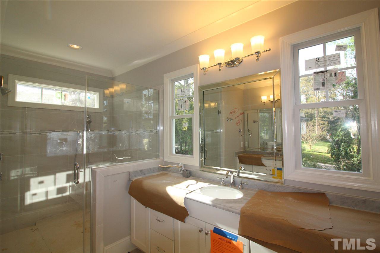 2705 1/2 Gordon Street Raleigh, NC 27608 - Photo 13 of 25 a bathroom with sink shower and a mirror