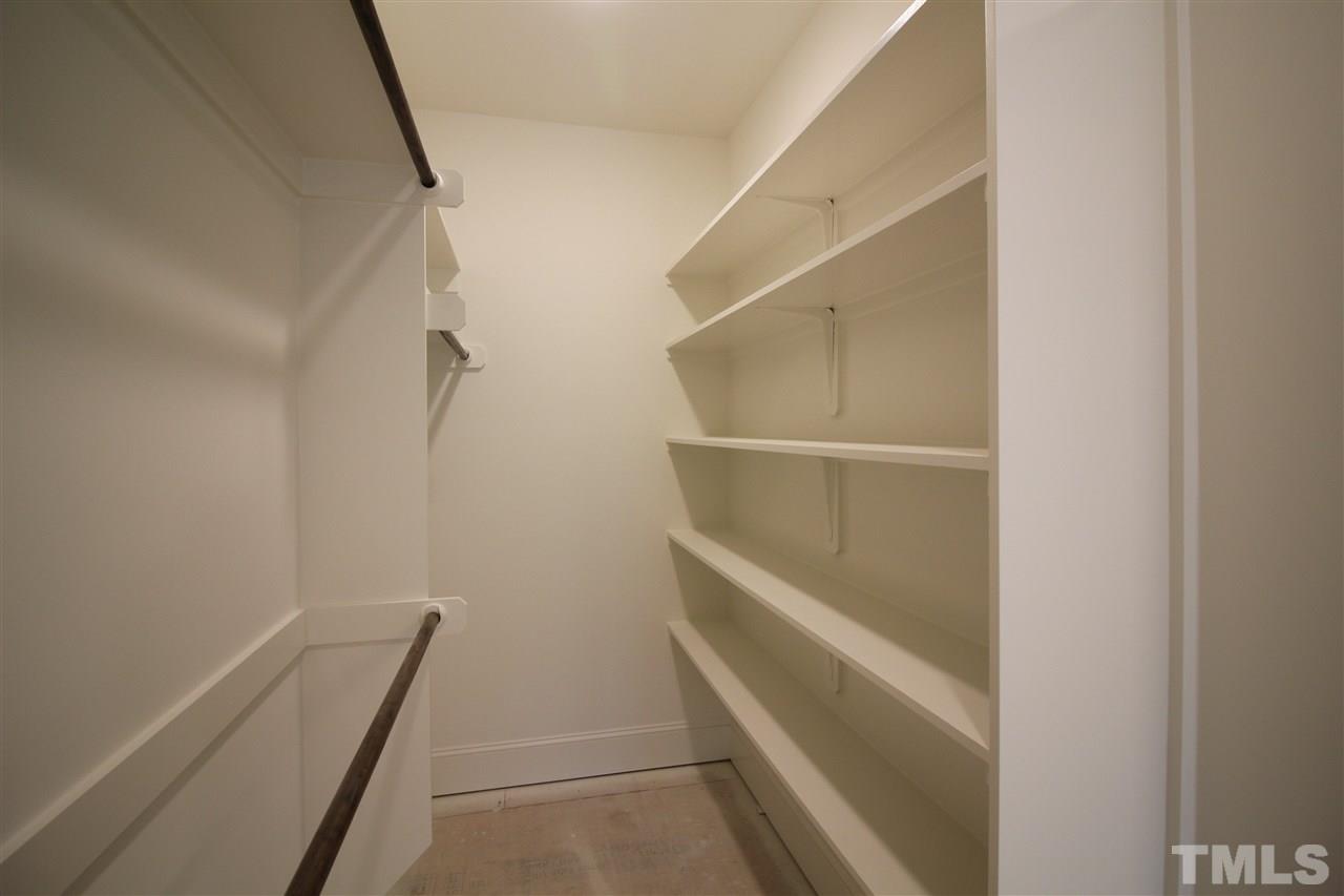 2705 1/2 Gordon Street Raleigh, NC 27608 - Photo 15 of 25 a view of walk in closet with empty racks
