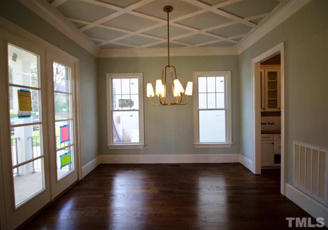 2705 1/2 Gordon Street Raleigh, NC 27608 - Photo 3 of 25 a view of empty room with wooden floor and fan