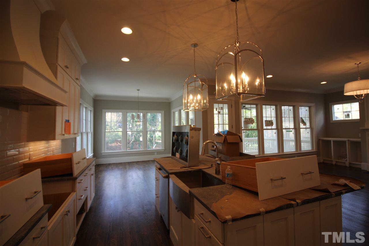 2705 1/2 Gordon Street Raleigh, NC 27608 - Photo 8 of 25 a view of a room with workspace and windows