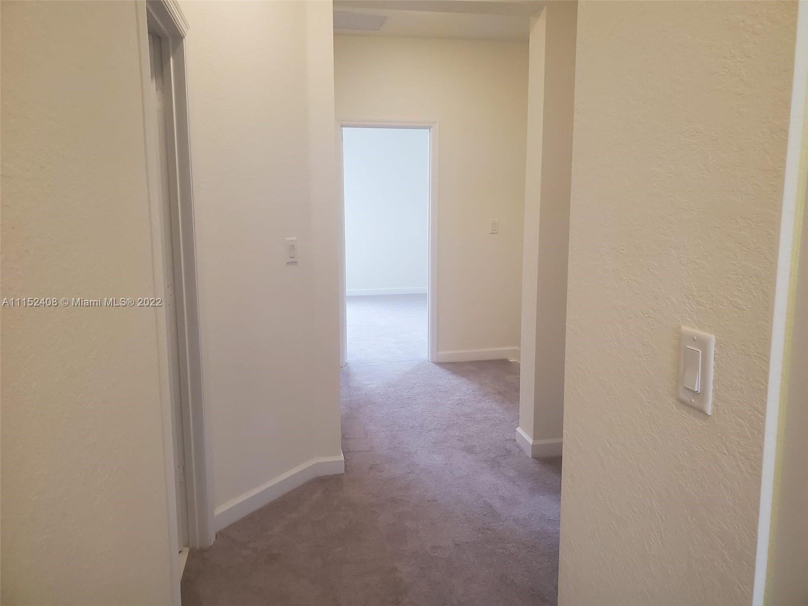 3326 West 112th Street, Unit 3326 Hialeah, FL 33018 - Photo 15 of 25 a view of a hallway