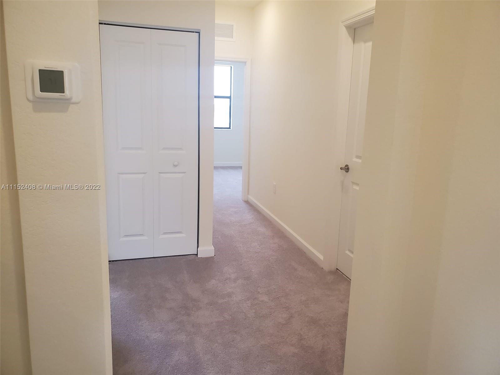 3326 West 112th Street, Unit 3326 Hialeah, FL 33018 - Photo 16 of 25 a view of an empty room