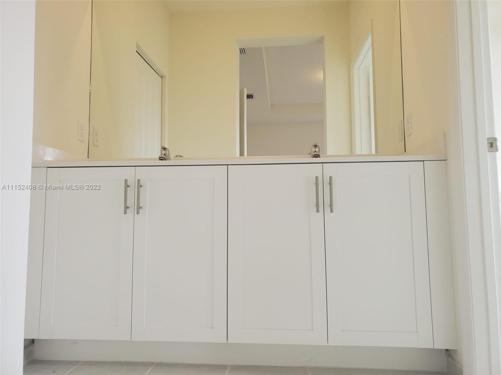 3326 West 112th Street, Unit 3326 Hialeah, FL 33018 - Photo 17 of 25 a view of a closet