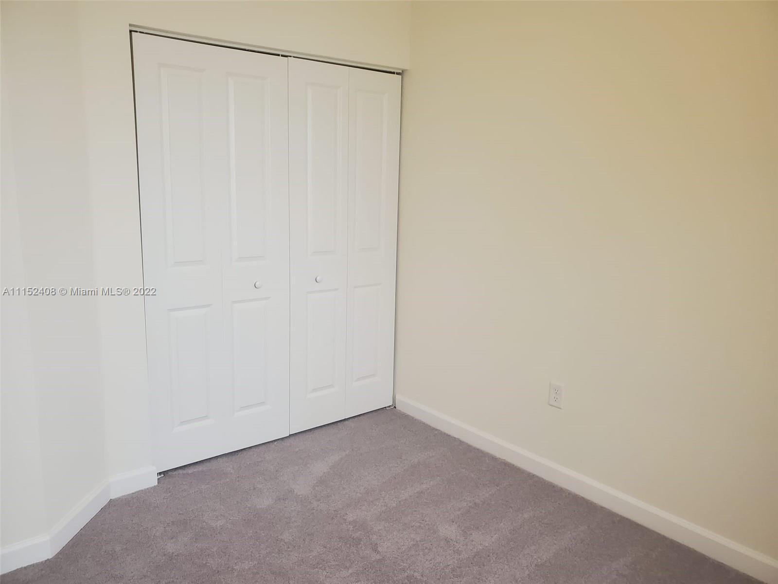 3326 West 112th Street, Unit 3326 Hialeah, FL 33018 - Photo 24 of 25 a view of an empty room