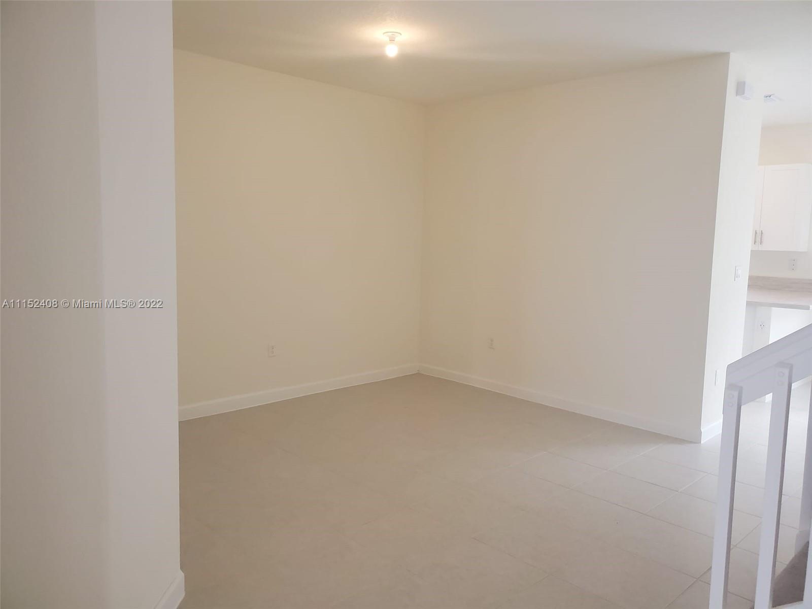 3326 West 112th Street, Unit 3326 Hialeah, FL 33018 - Photo 5 of 25 a view of an empty room