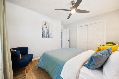 a bedroom with a bed and a couch