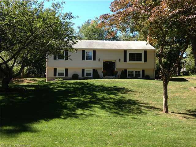 15 Old Farms Road Madison, CT 06443 - Photo 1 of 1 a front view of house with yard and green space