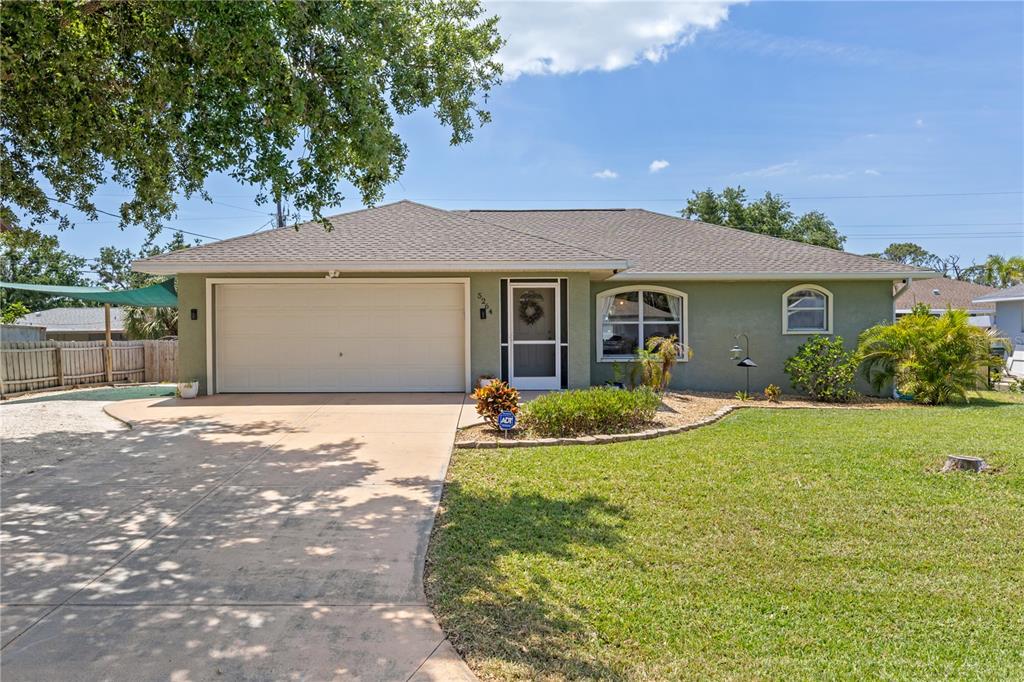 5264 Albion Road Venice, FL 34293 - Photo 1 of 1 a front view of house with yard and green space