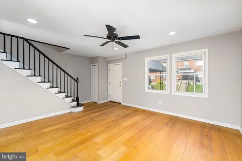 a view of an empty room with windows