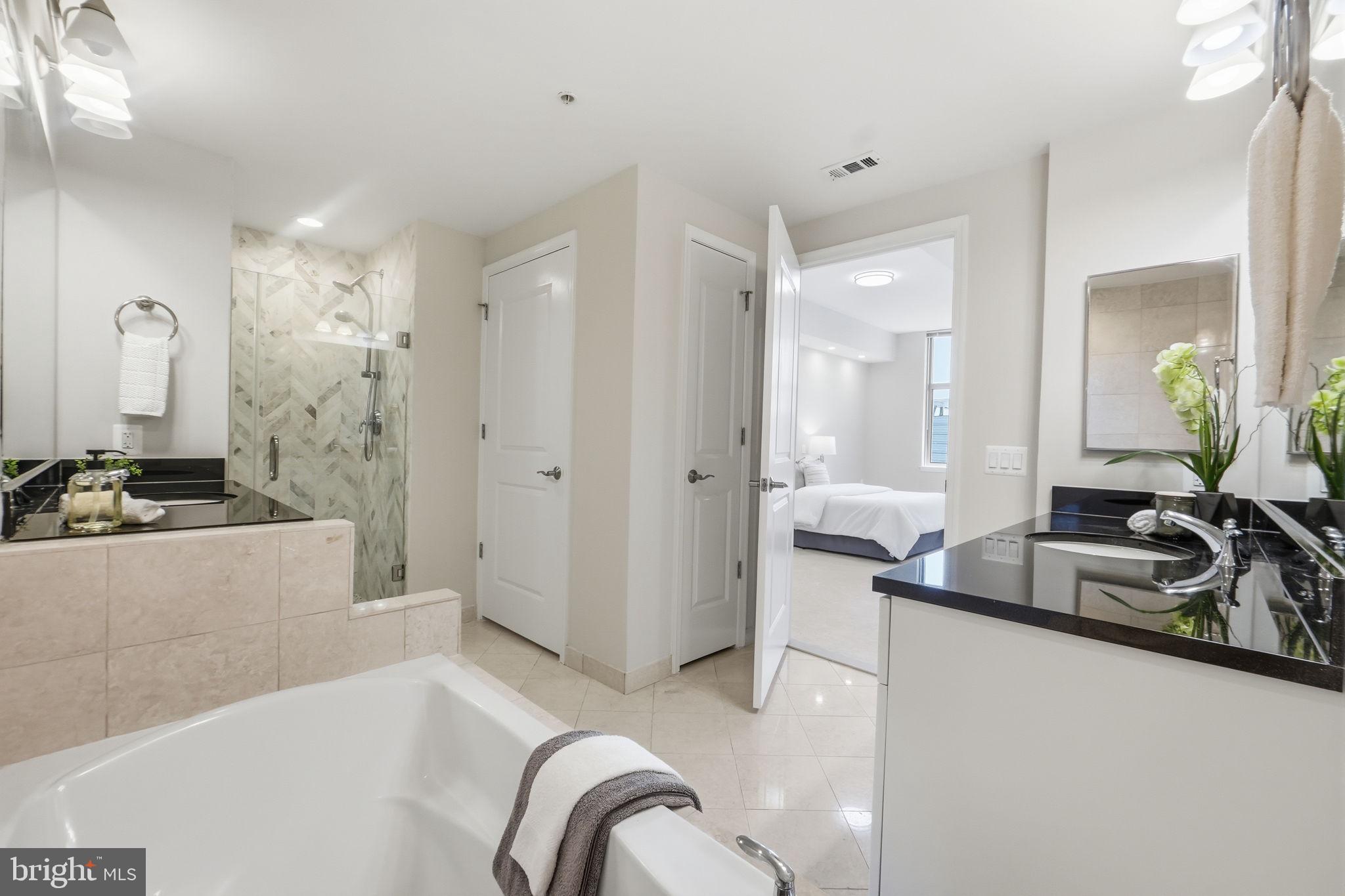 11990 Market Street, Unit 2103 Reston, VA 20190 - Photo 47 of 78 Modern elegance in a serene bathroom.