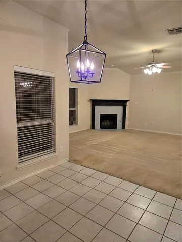 a view of a livingroom with furniture and chandelier