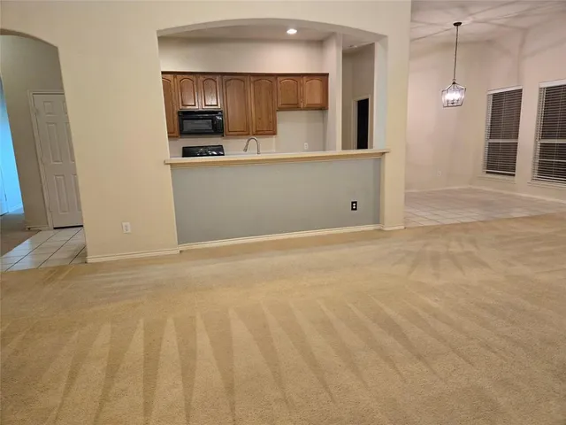 a view of kitchen with wooden floor