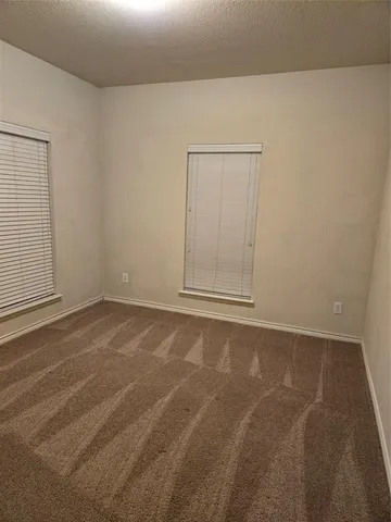 an empty room with a empty space and window