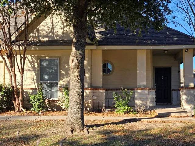 a front view of a house with street view
