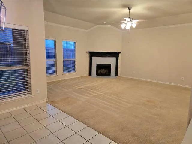 a view of an empty room with a fireplace