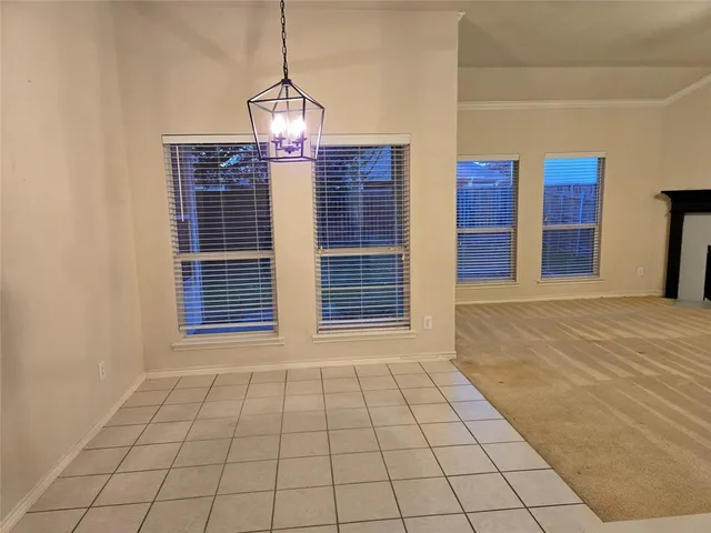 a view of an empty room with windows