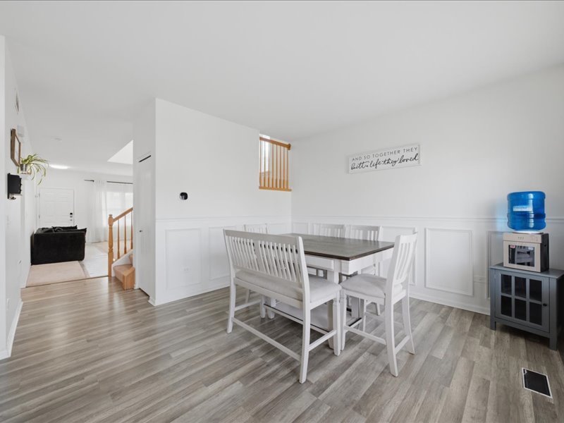 4201 Dillon Street Plano, IL 60545 - Photo 16 of 37 a view of a dining room with furniture and wooden floor