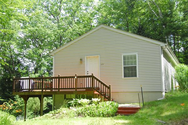 207 Whiley Road Groton, MA 01450 - Photo 2 of 14 a front view of a house having yard and green space