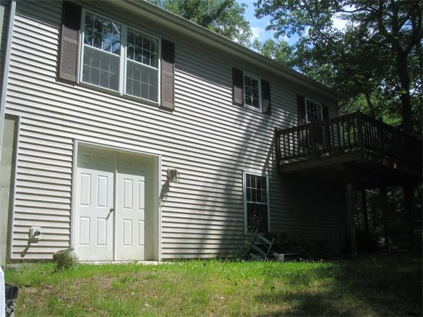 207 Whiley Road Groton, MA 01450 - Photo 5 of 14 a side view of a house with a yard