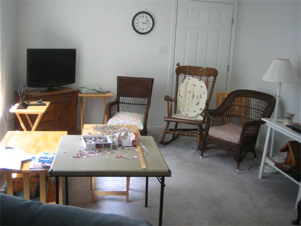 207 Whiley Road Groton, MA 01450 - Photo 6 of 14 a living room with furniture and a flat screen tv