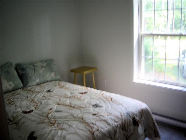 207 Whiley Road Groton, MA 01450 - Photo 8 of 14 a bedroom with a bed and a window