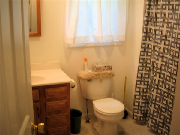 207 Whiley Road Groton, MA 01450 - Photo 10 of 14 a bathroom with a sink and a toilet