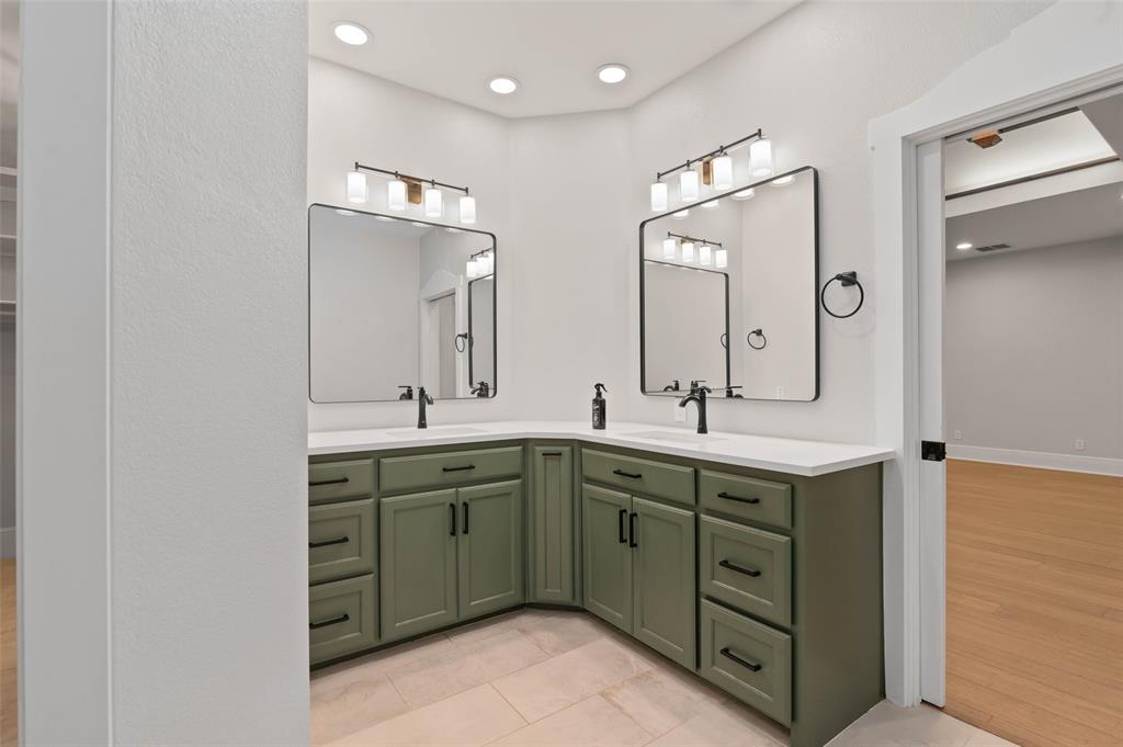 124 Garza Road Shady Shores, TX 76208 - Photo 17 of 40 Luxe primary bathroom with oversized walk in shower, dual sinks and quartz countertops