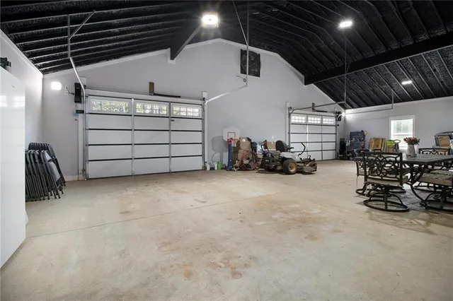 a view of a garage with parked cars