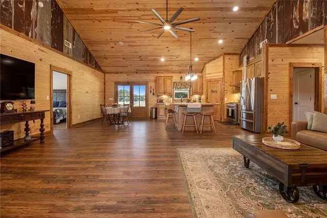 a living room with lots of furniture and a flat screen tv