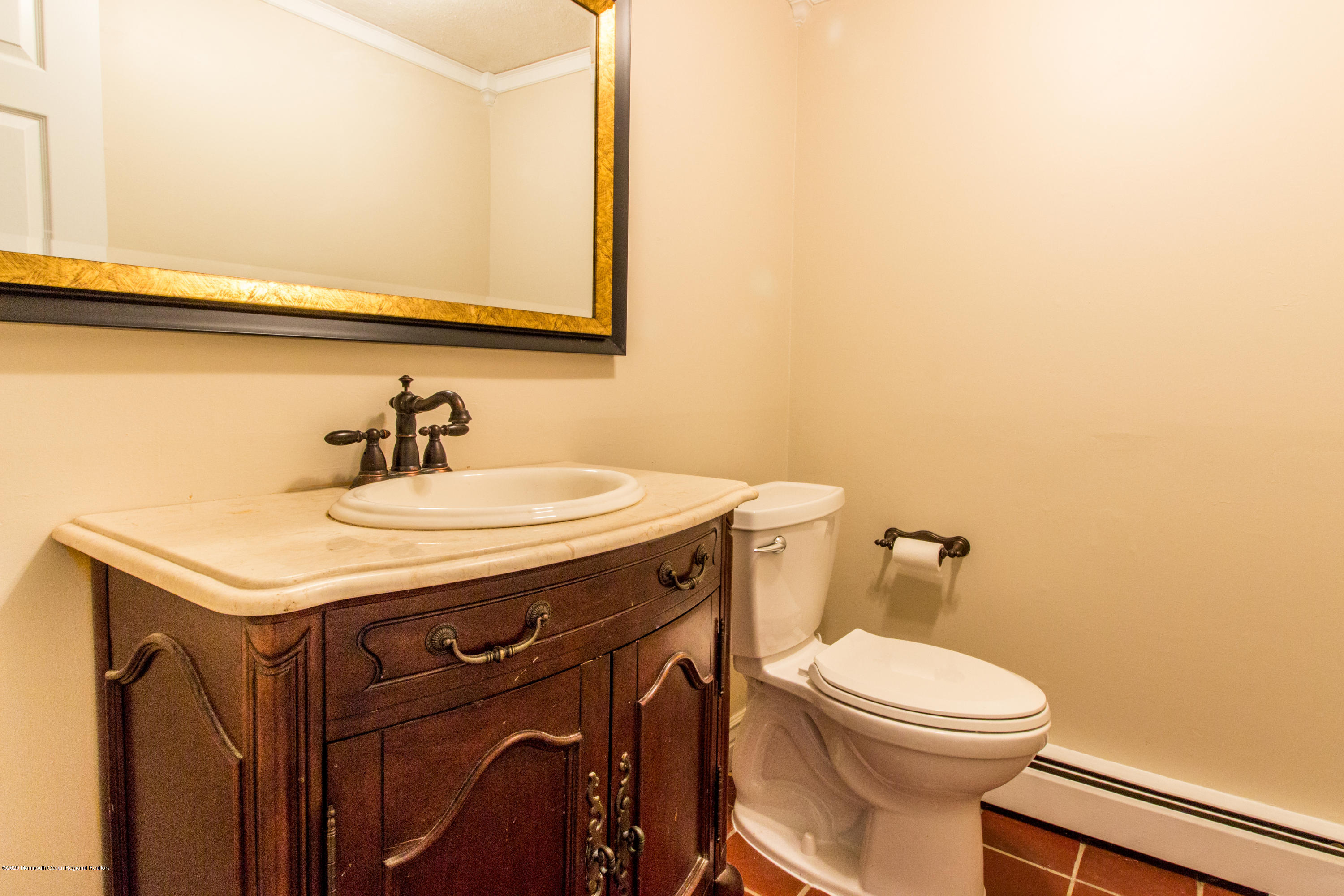 14 Hill Road Lincroft, NJ 07738 - Photo 18 of 29 a bathroom with a sink and a toilet