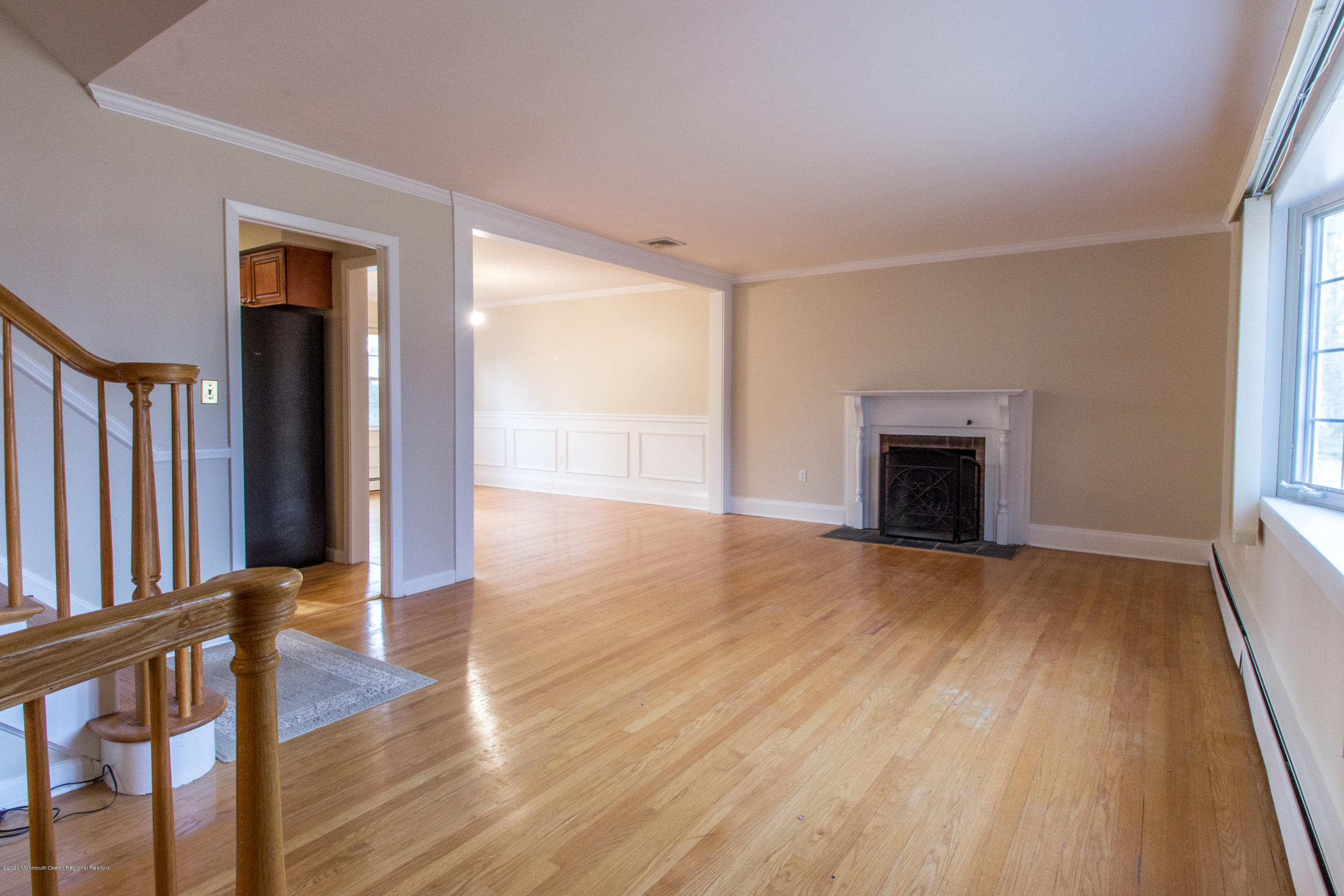 14 Hill Road Lincroft, NJ 07738 - Photo 5 of 29 wooden floor fireplace and windows in an empty room