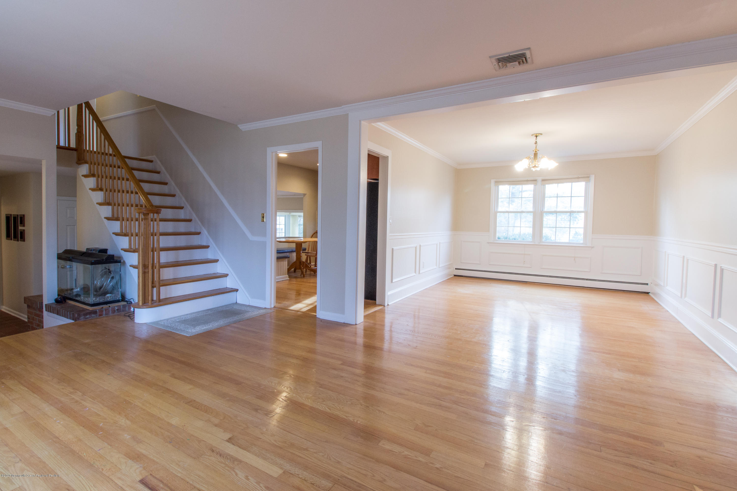 14 Hill Road Lincroft, NJ 07738 - Photo 6 of 29 a view of an empty room with wooden floor and stairs