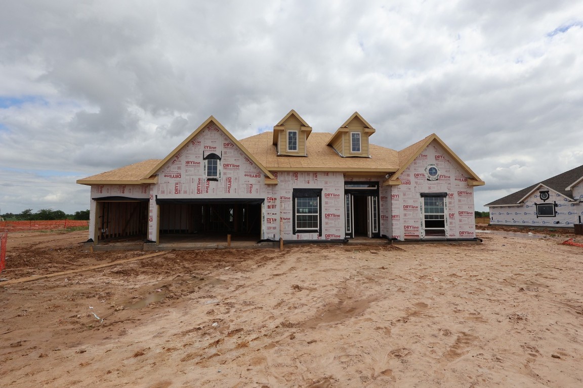 5033 Bluebell Way Waller, TX 77484 - Photo 2 of 23 a front view of a house with a yard and garage