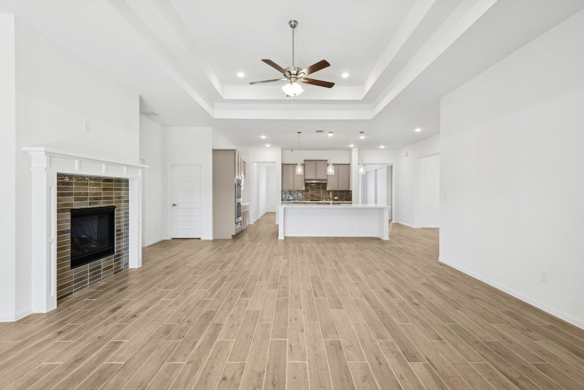 5033 Bluebell Way Waller, TX 77484 - Photo 9 of 23 a view of a kitchen with a stove cabinets and wooden floor