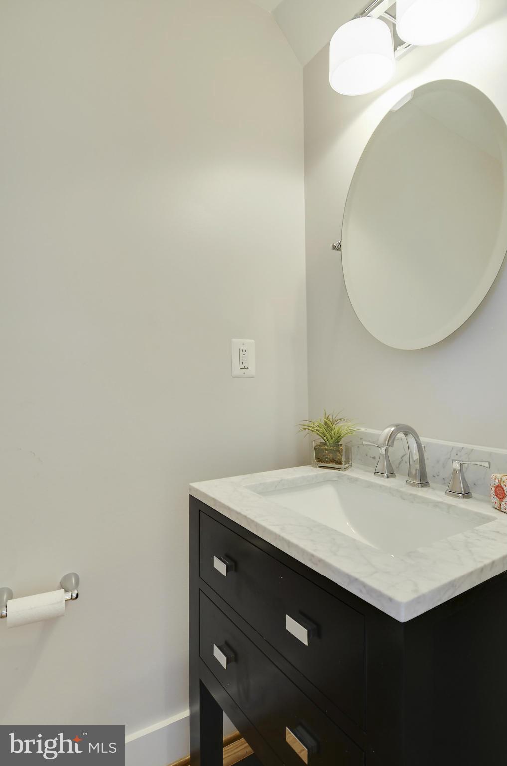 1350 K Street Southeast Washington, DC 20003 - Photo 11 of 28 a bathroom with a sink and a mirror