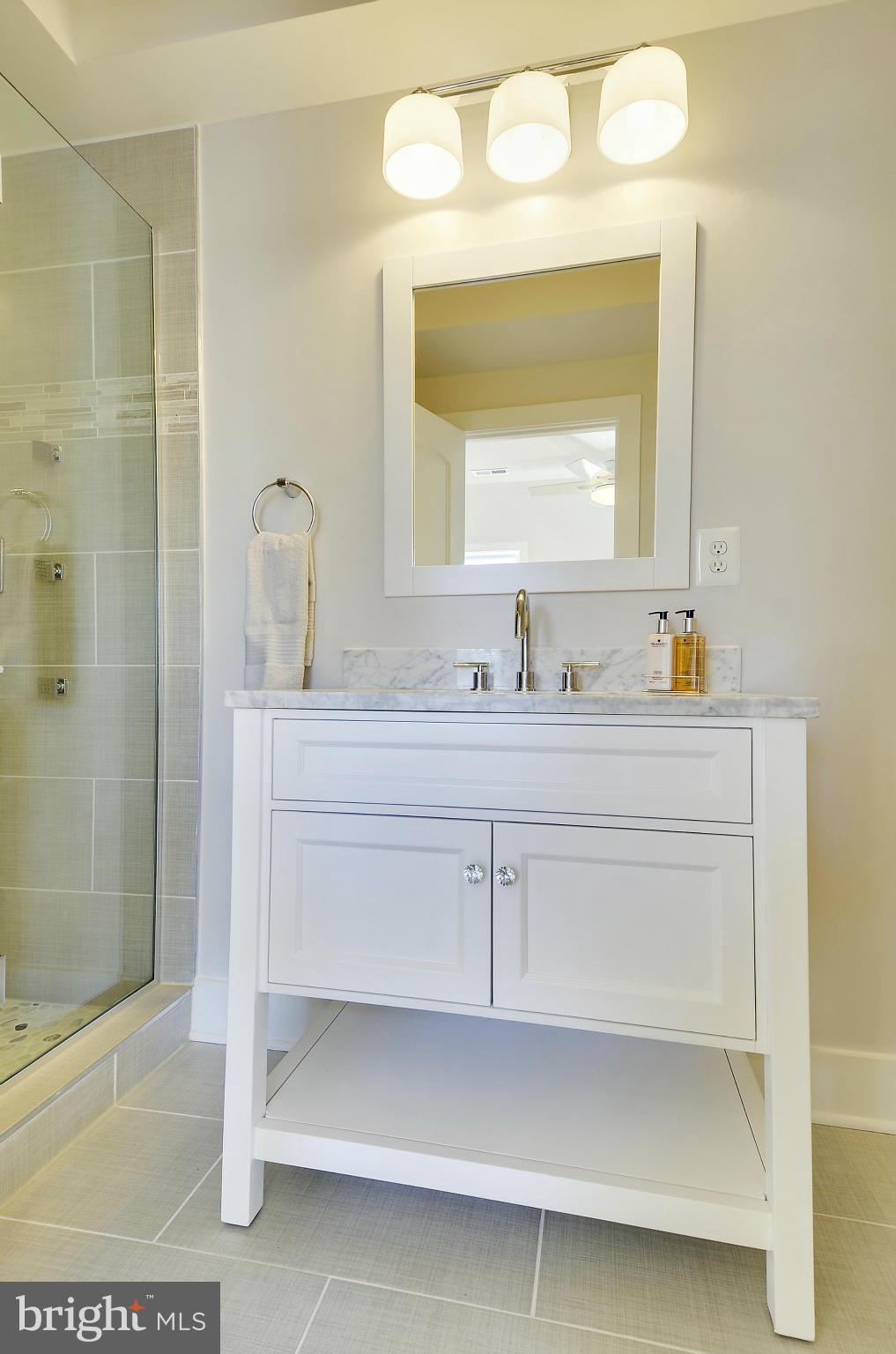 1350 K Street Southeast Washington, DC 20003 - Photo 14 of 28 a bathroom with a sink vanity and mirror
