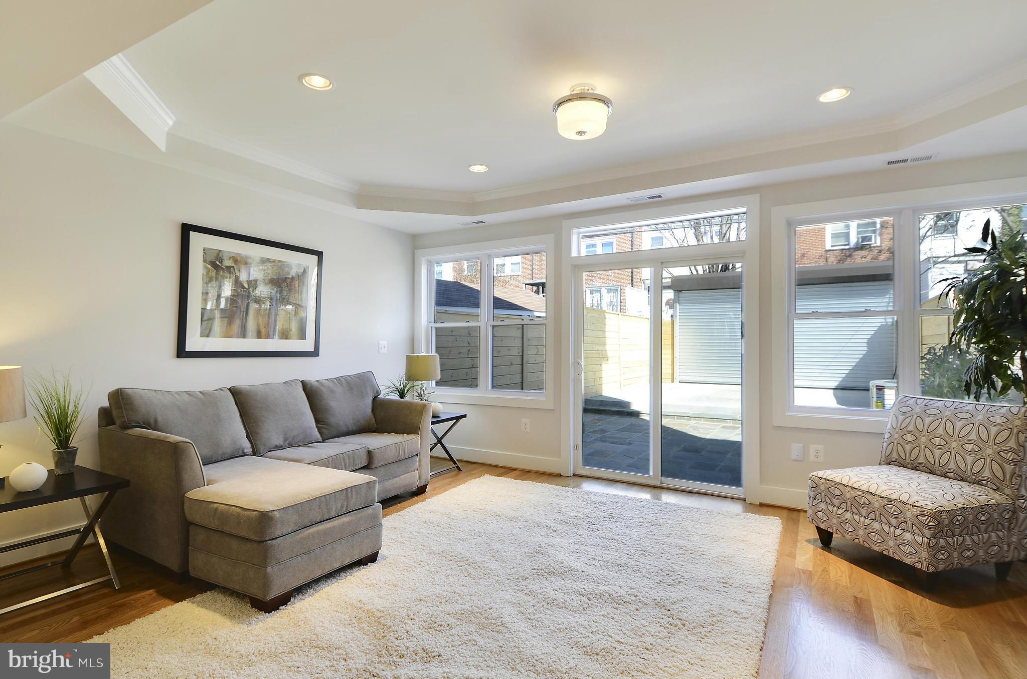 1350 K Street Southeast Washington, DC 20003 - Photo 9 of 28 a living room with furniture and a large window