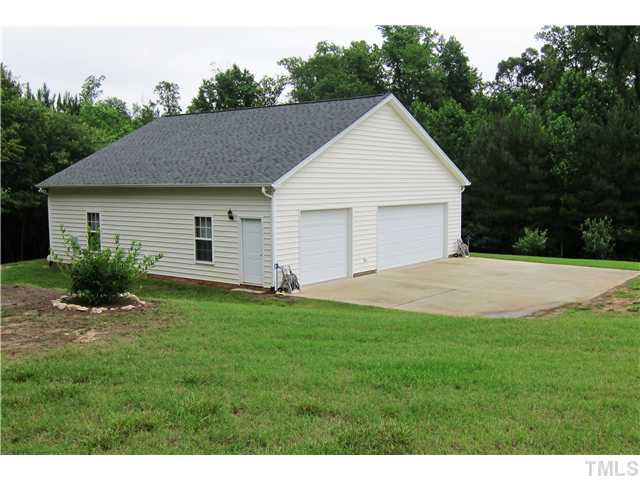 2000 Wheelerbrook Court Raleigh, NC 27603 - Photo 2 of 12 40x40 Custom Built Detached Garage/Workshop with Electricity, Separate Alarm System, Separate Electric Meter. Room for 3 vehicles plus Workshop and loft storage! Can you say "Man Cave?"
