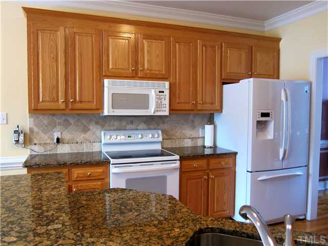 2000 Wheelerbrook Court Raleigh, NC 27603 - Photo 6 of 12 Immaculate Kitchen is between the formal Dining Room and Large Breakfast Nook.