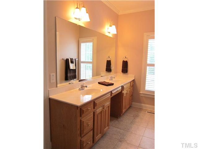 2000 Wheelerbrook Court Raleigh, NC 27603 - Photo 9 of 12 Dual Sinks, New Tile, Separate Whirlpool Tub and Shower, Toilet Room and Walk In Master Closet complete the Master Suite!
