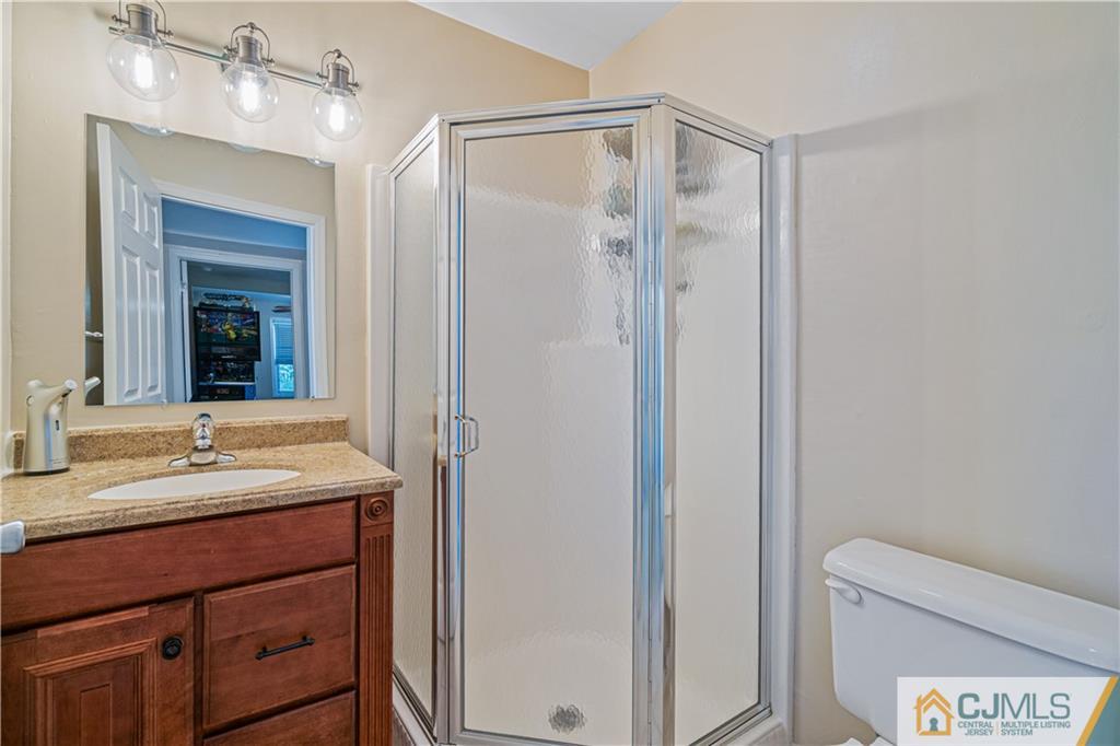 18 Main Street Helmetta, NJ 08828 - Photo 12 of 32 a bathroom with a double vanity sink mirror and double