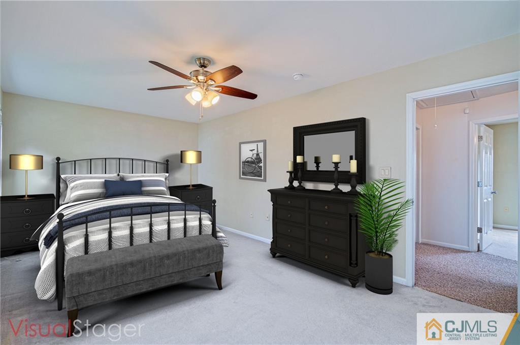 18 Main Street Helmetta, NJ 08828 - Photo 16 of 32 a bedroom with bed and a chandelier