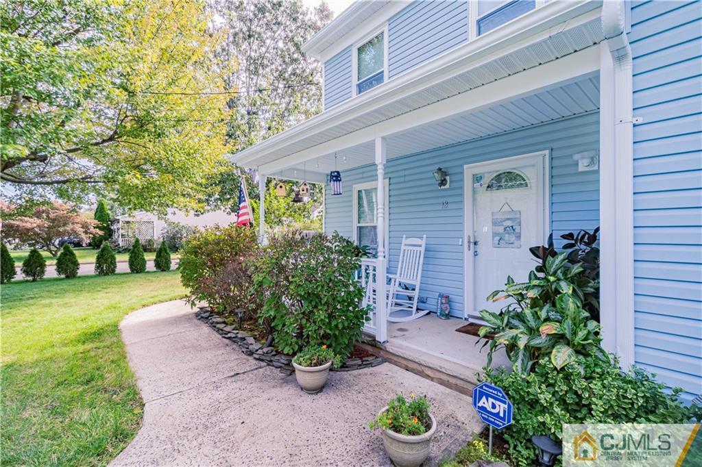 18 Main Street Helmetta, NJ 08828 - Photo 2 of 32 a front view of a house with a yard