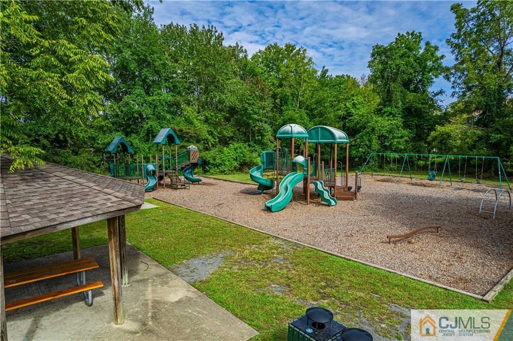 18 Main Street Helmetta, NJ 08828 - Photo 29 of 32 a view of a wooden deck with a table and chairs