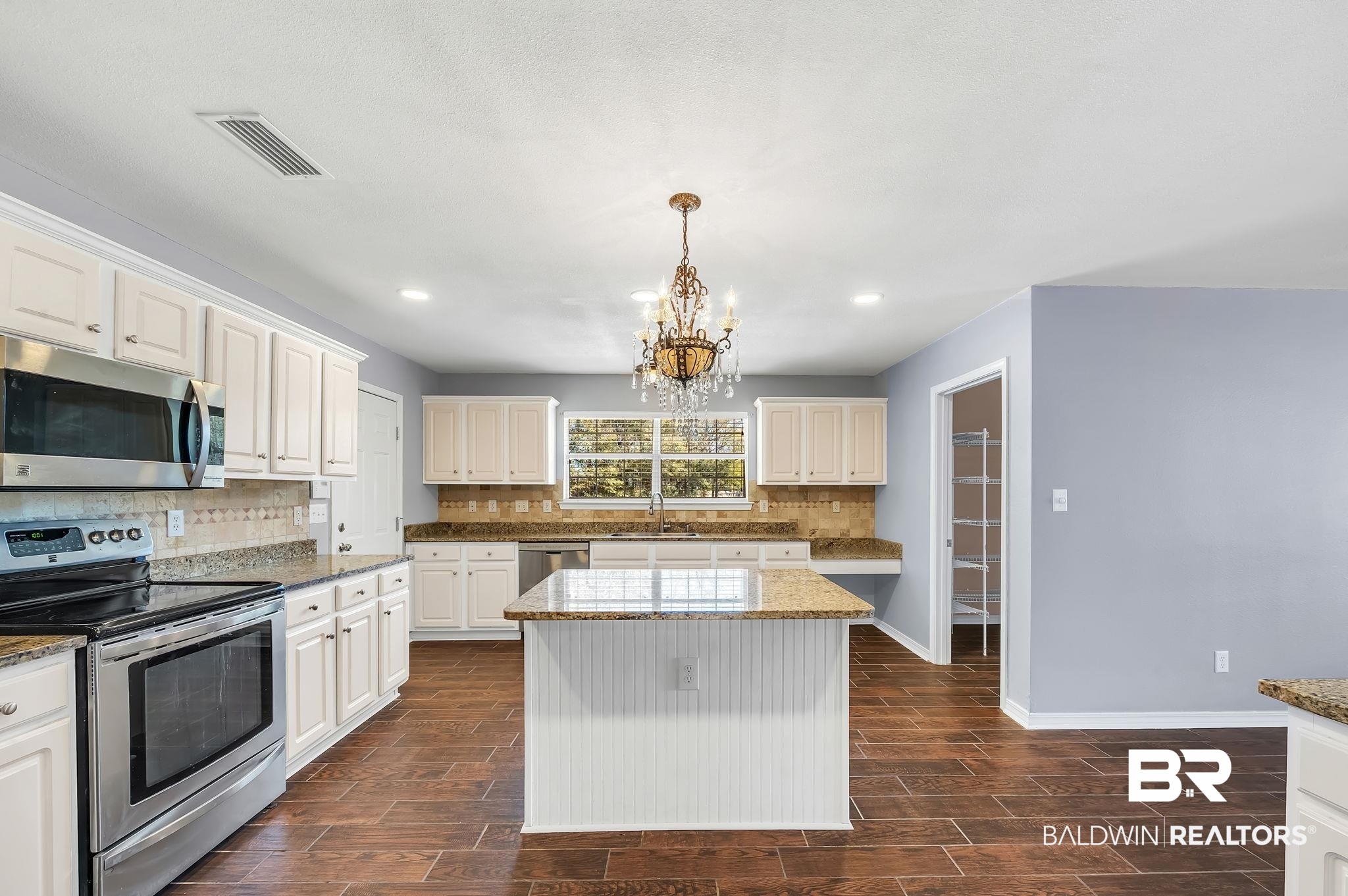 16444 Hamlet Lane Foley, AL 36535 - Photo 18 of 49 Kitchen with a sink, a chandelier, tasteful backsplash, appliances with stainless steel finishes, and visible vents