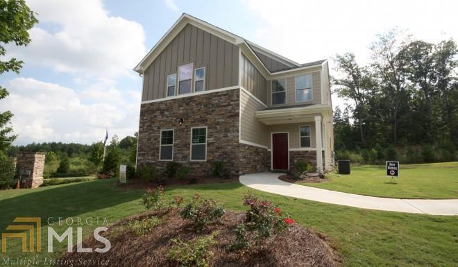 1203 Pebble Rock Road Hampton, GA 30228 - Photo 1 of 1 a front view of a house with a yard