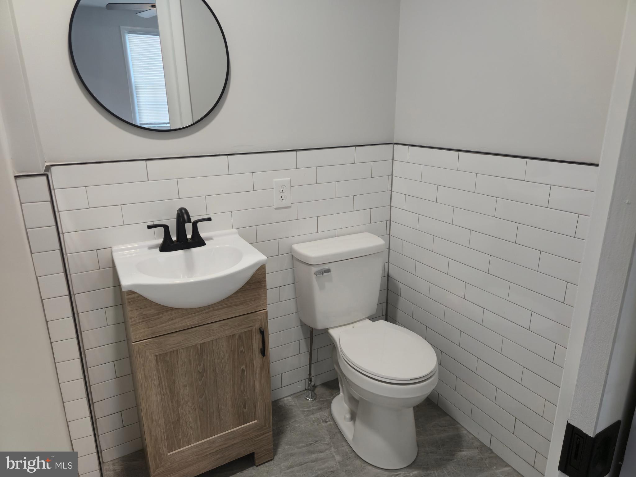 212 New Albany Road Moorestown, NJ 08057 - Photo 11 of 26 a bathroom with a sink a toilet and a mirror