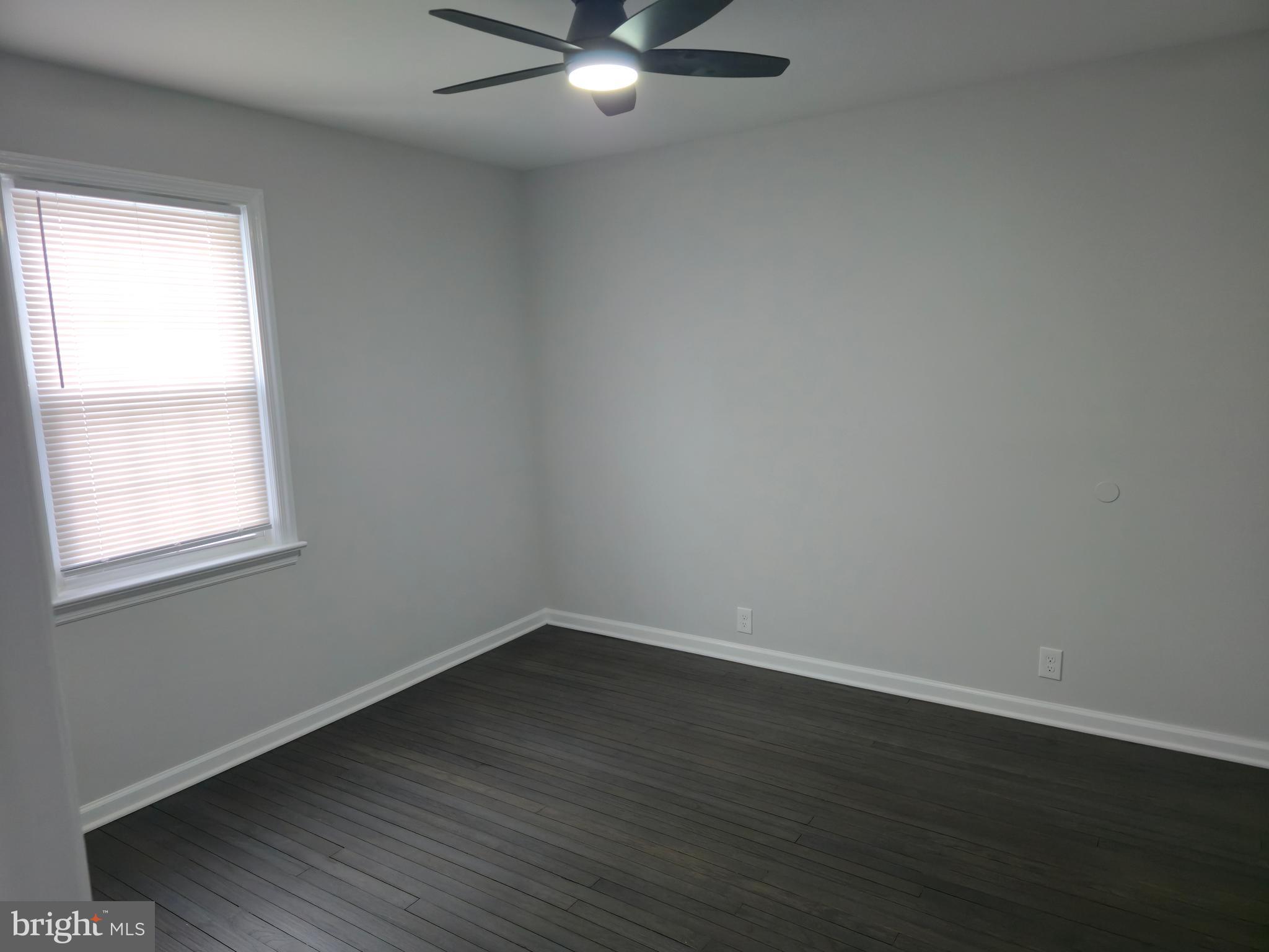 212 New Albany Road Moorestown, NJ 08057 - Photo 18 of 26 an empty room with wooden floor and windows