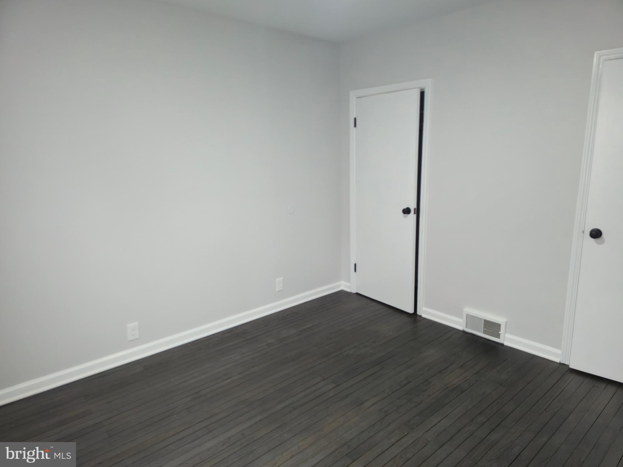 212 New Albany Road Moorestown, NJ 08057 - Photo 19 of 26 a view of an empty room with wooden floor